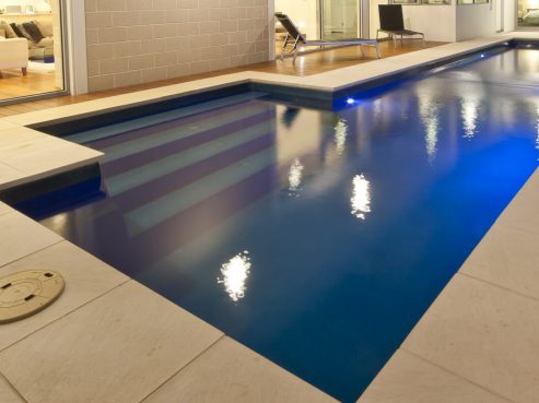 Fastlane swimming pool with water feature
