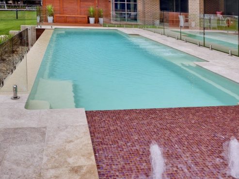 Mark Pollard Pools Family pool with sunpod water feature and spa jets installed in NSW