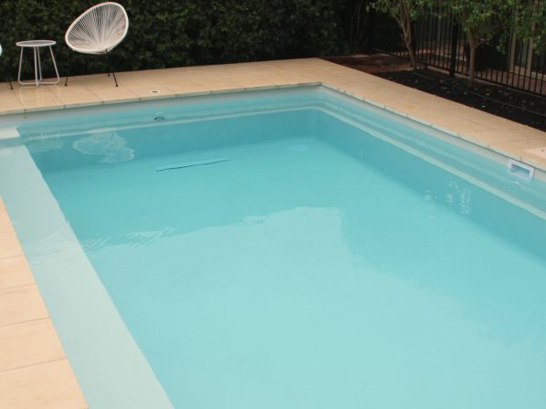 Sanctuary familly swimming pool design with glass fencing