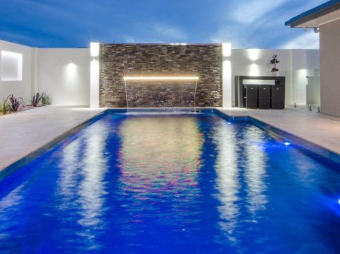 Mark Pollard Pools Vogue family pool with pool lights and waterwall water feature