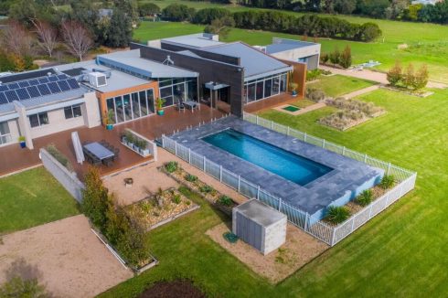 Partially above the ground Compass pool installation